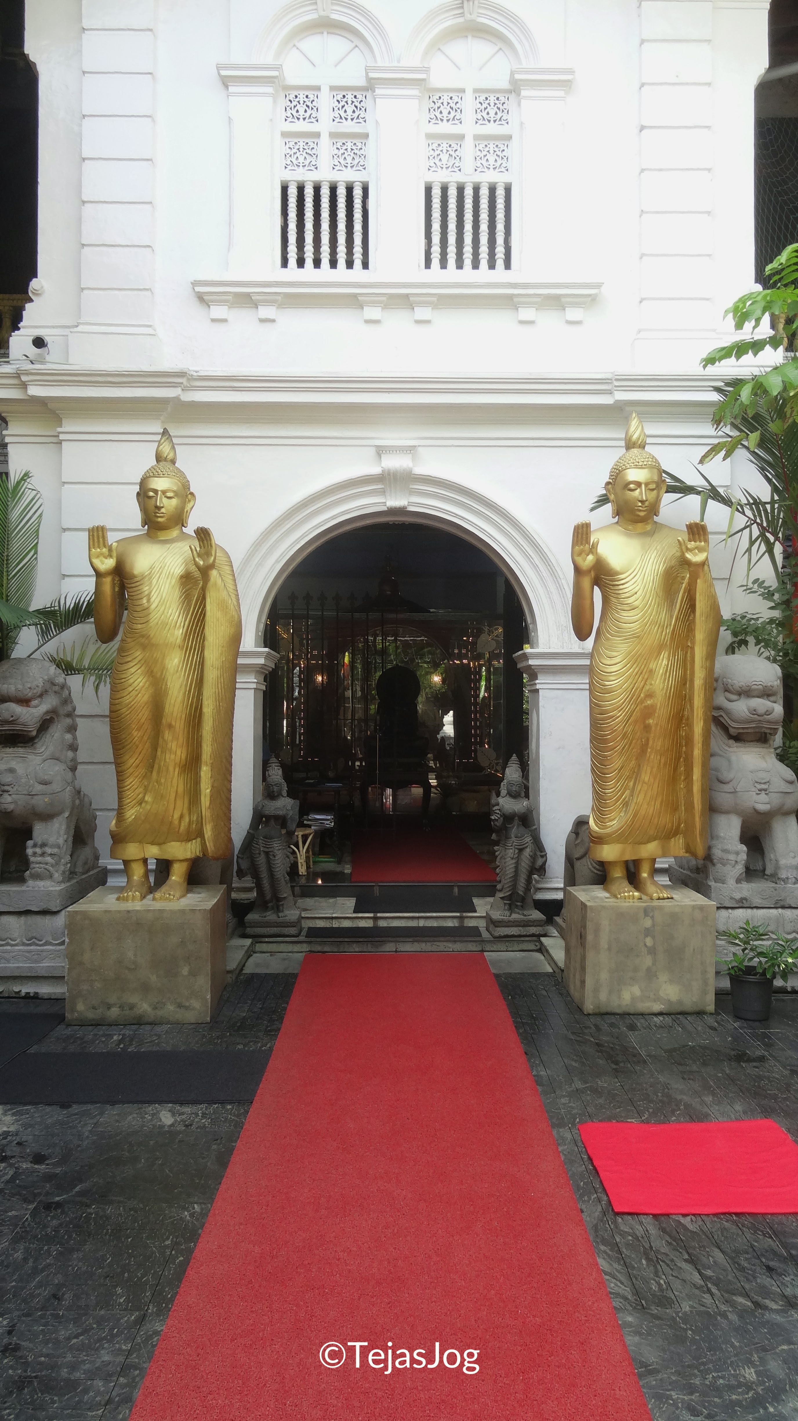 Entrance flanked by standing Buddhas
