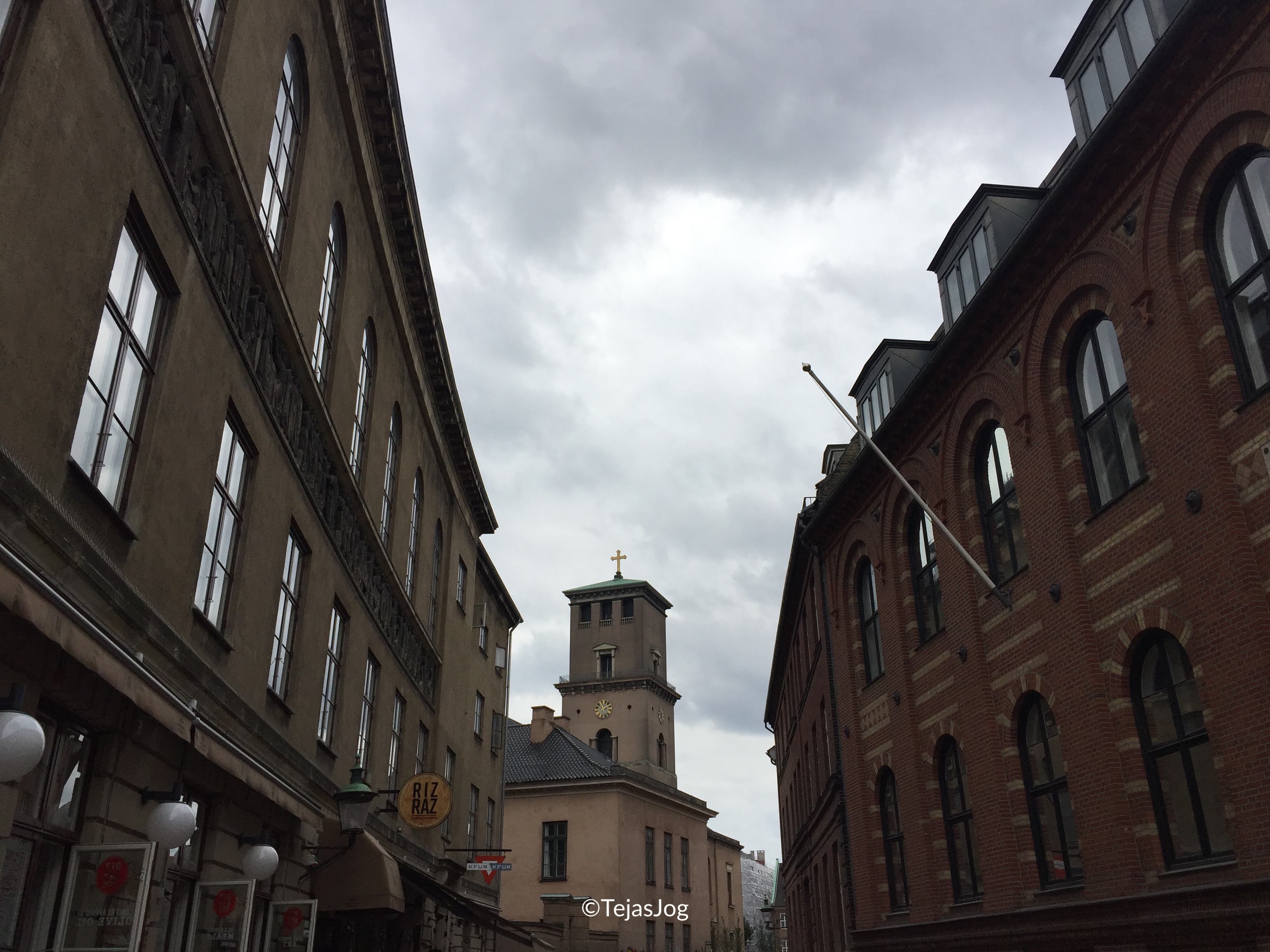 The tower of the Church of Our Lady framed by the academic buildings of the University of Copenhagen