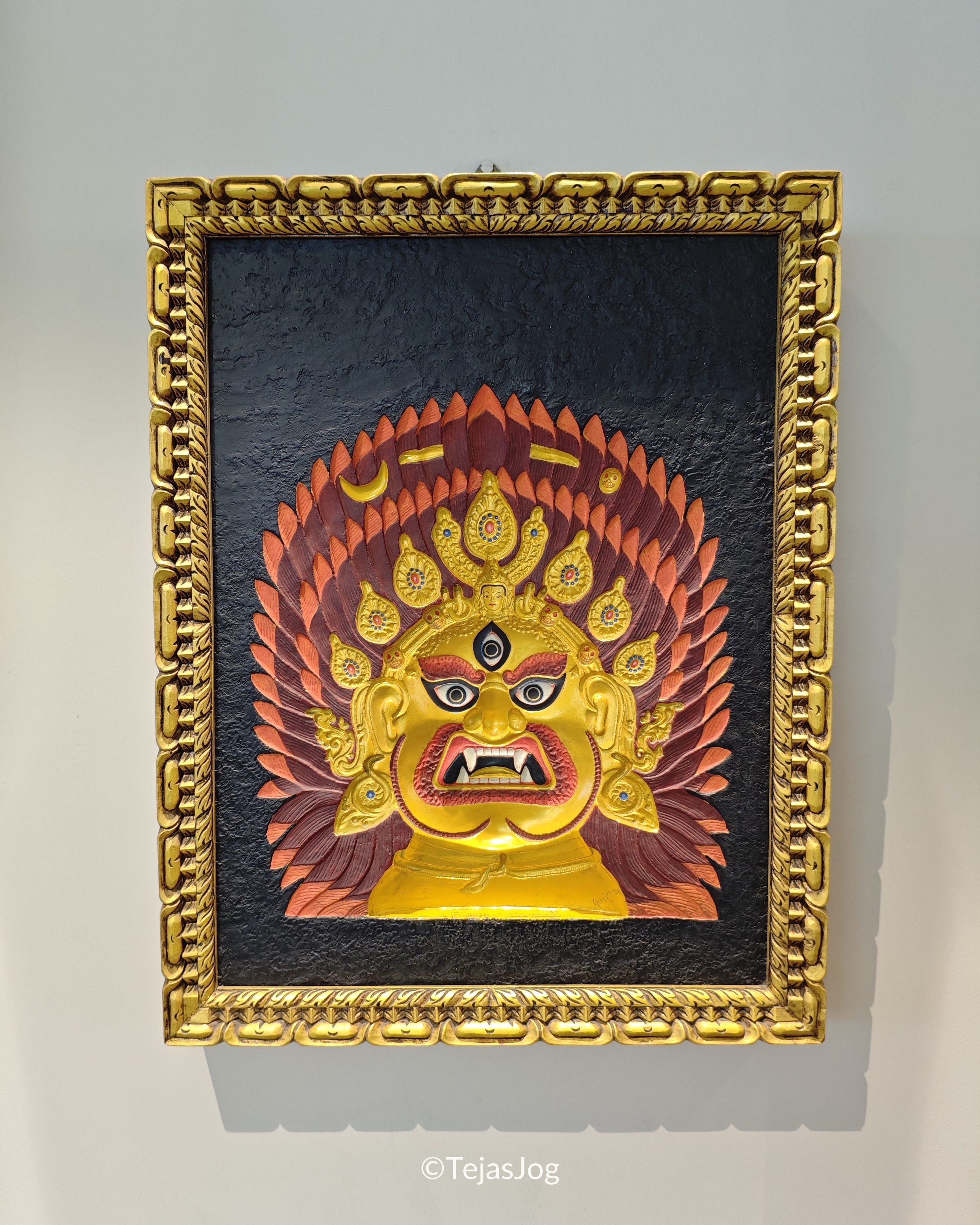 Traditional Nepali mask artwork at the airport